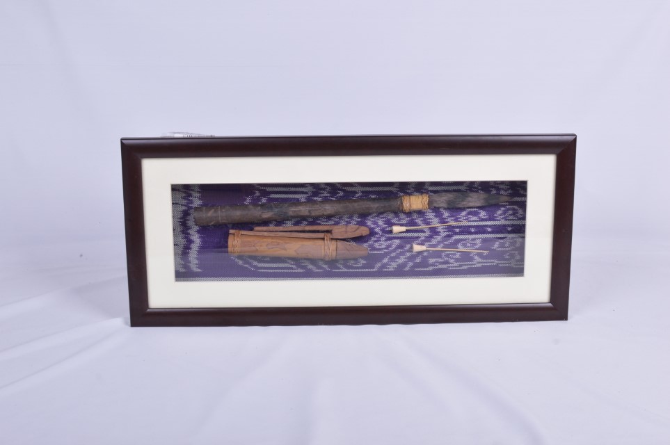 Traditional Borneo Sumpit in Glass Frame with Batik Backdrop 